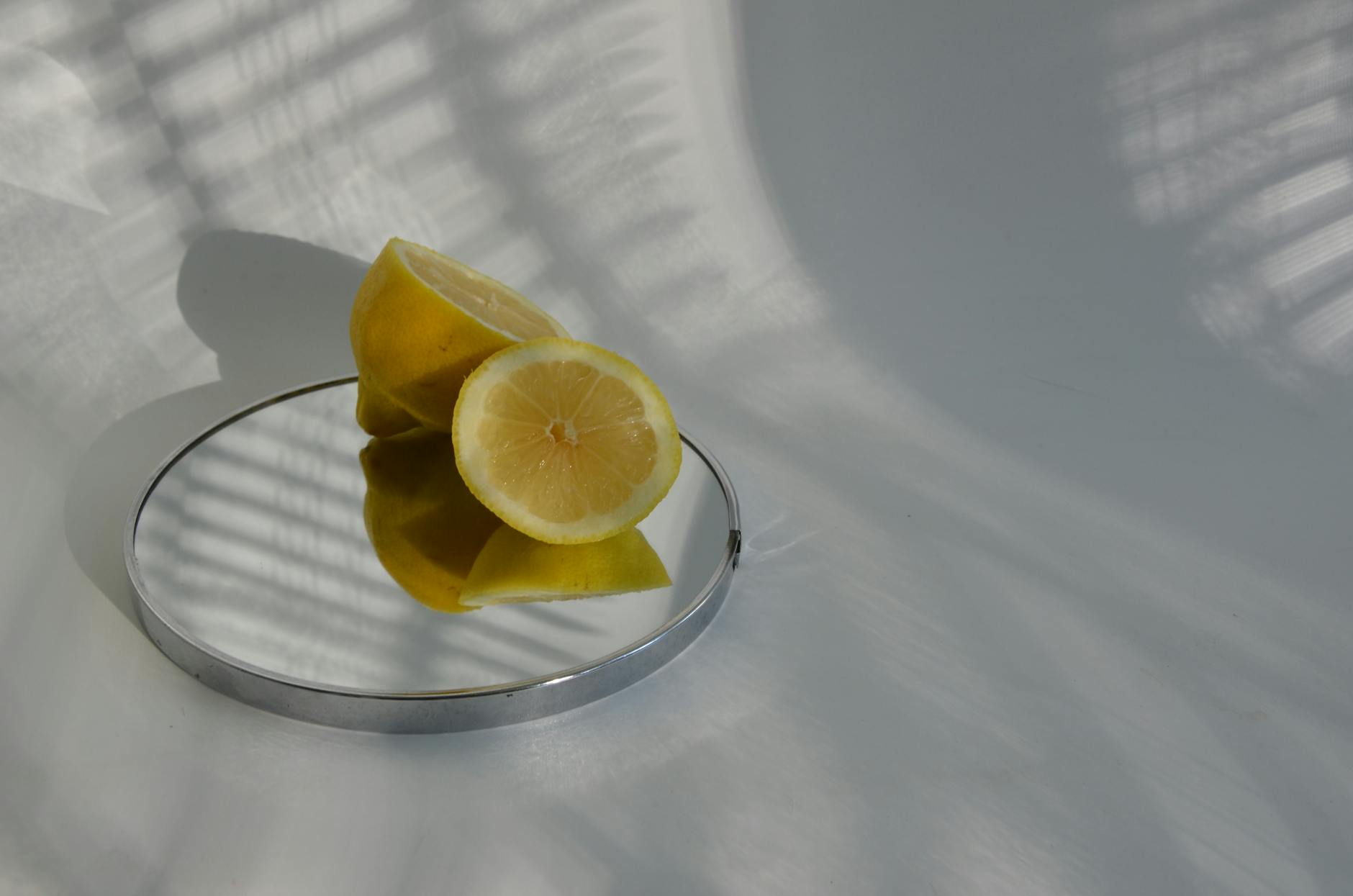 Bright yellow lemons arranged on a pastel green background, symbolizing variable pleasure and sensation